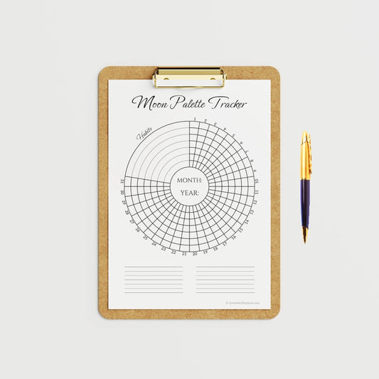 Mockup image of the Moon Palette Circular Monthly Habit Tracker Printable Template. The black and white coloring page is shown blank and secured to a clipboard. This image highlights the clean, circular design ready for monthly habit and goal tracking.